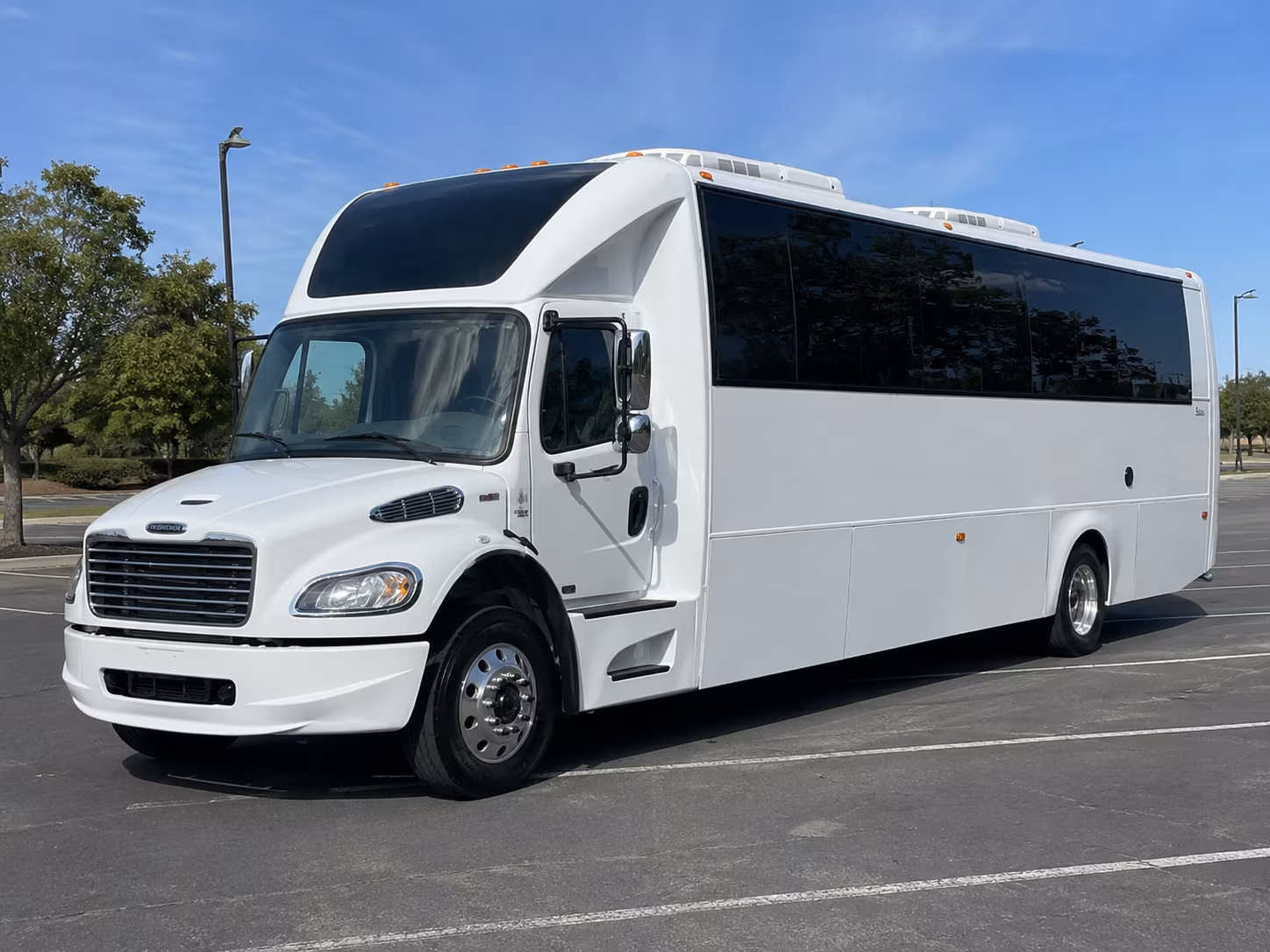 Group beside a Mercedes Sprinter limo in Fremont